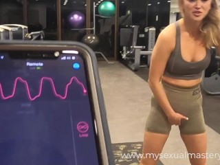 Sexy Girl Working out with Remote Control Sex Toy in Public Gym